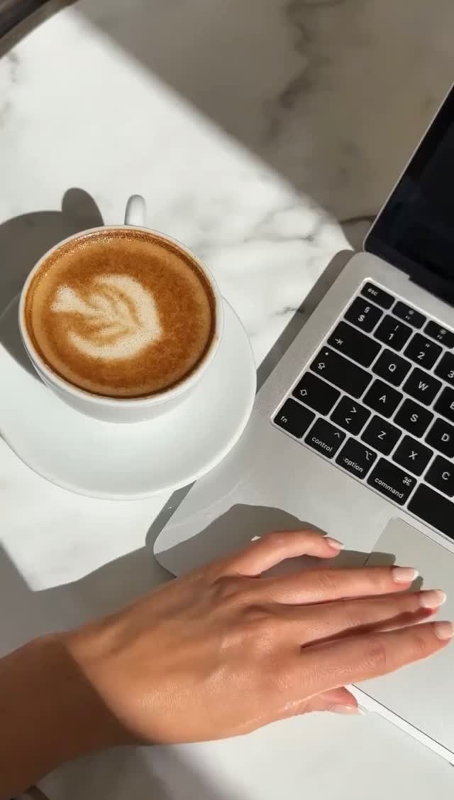 Coffee and laptop during a marketing strategy session